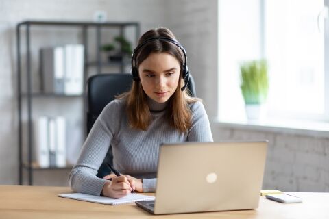 Girl Studying Online Using Laptop Web Camera, Writing Lecture In Notebook.Online Education, Remote Working, Home Education.Online Meeting,video Call, Video Conference, Courses Online
